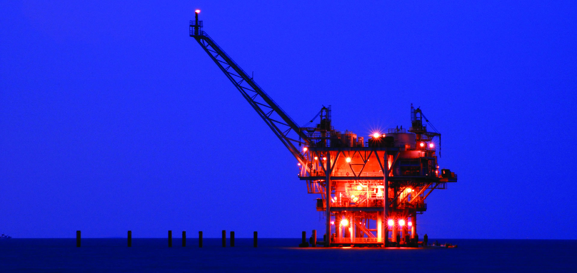 offshore oil rig at night